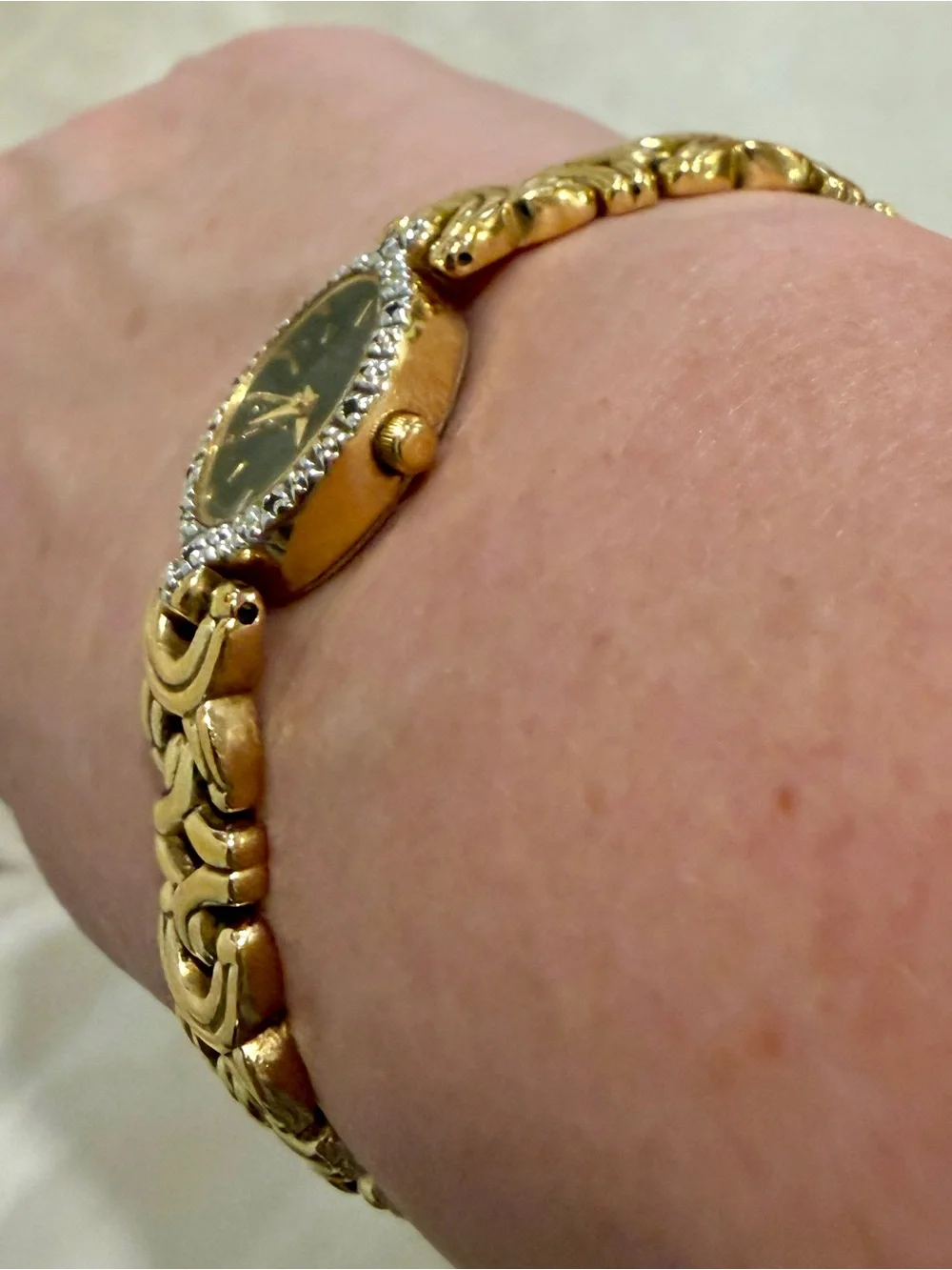 Bulova Gold Tone Dainty Oval Wristwatch Black Dial Textured Bezel Link Bracelet
